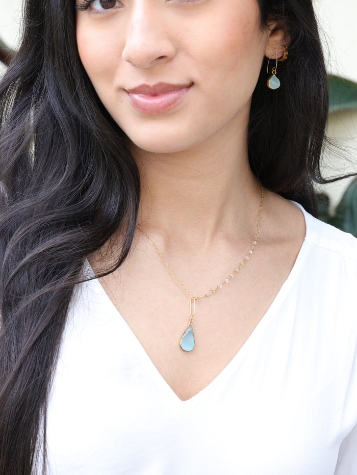 Nova earring on model paired with necklace