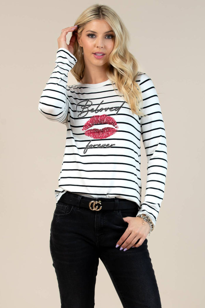 Women's striped long sleeve top with a playful lip graphic and script design on the front.