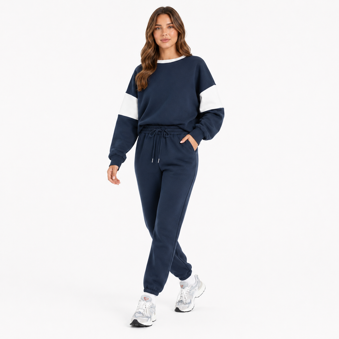 Women's navy drop shoulder sweatshirt set shown in a walking pose on a clean white studio background