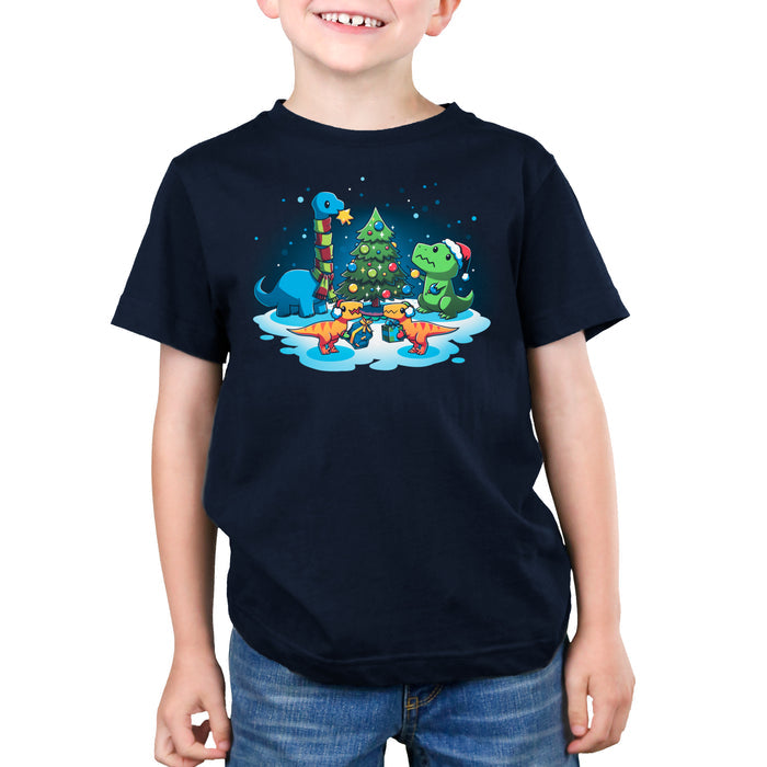 Premium Cotton T-shirt_TeeTurtle navy blue A Very Dino Christmas featuring dinosaurs celebrating around a decorated Christmas tree with snow on the ground and dinosaurs holding presents.