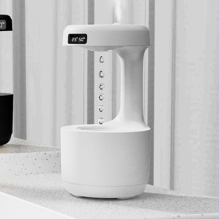 Anti gravity humidifier close-up showing the LED clock, mist outlet and water-drop display for shoppers reviewing desktop use