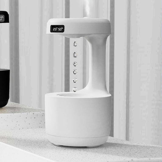 Anti gravity humidifier close-up showing the LED clock, mist outlet and water-drop display for shoppers reviewing desktop use