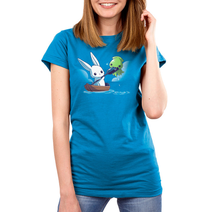 Premium Cotton T-shirt_TeeTurtle cobalt blue Baby Kraken Attack apparel featuring a baby kraken chomping on an oar being held by a bunny in a boat.