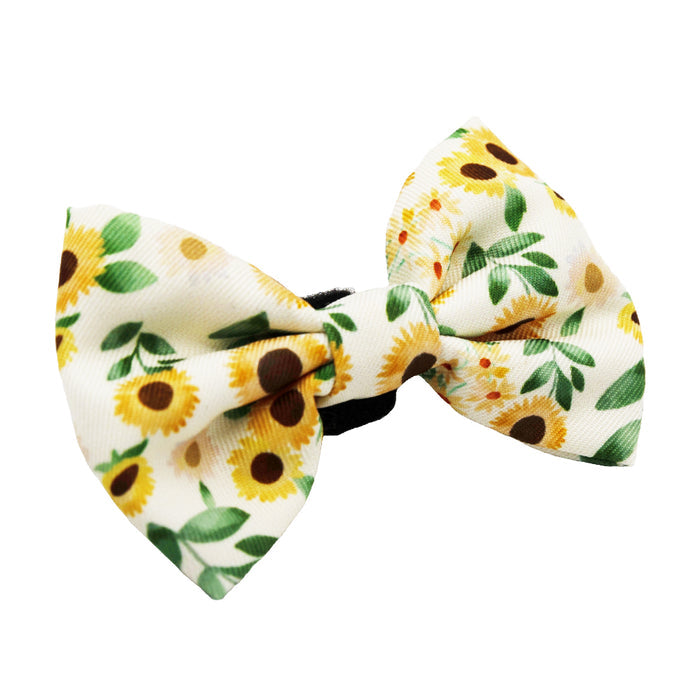 The Cat Bowtie - Sunflower Dreams by Sassy Woof features yellow sunflowers with green leaves on white—ideal for chic matching with a harness or cat collar for stylish sunflower cat accessories.