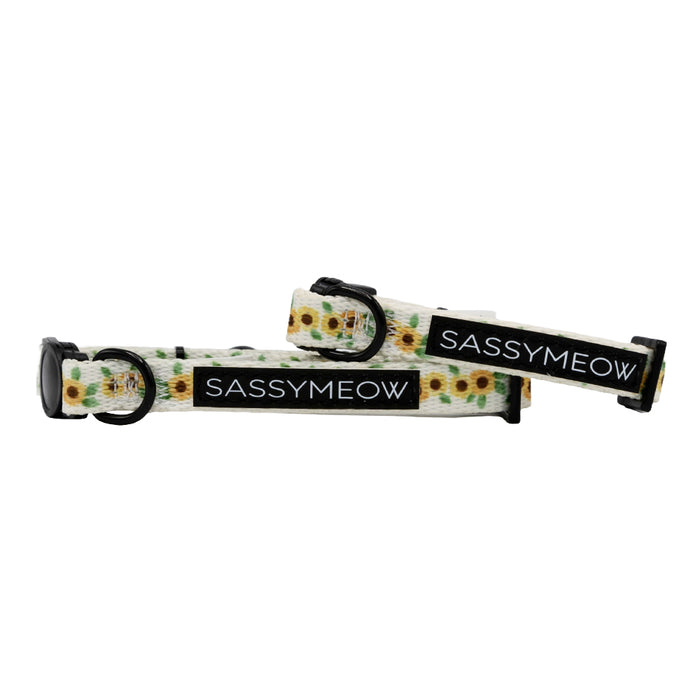 Two Cat Collar - Sunflower Dreams by Sassy Woof are stylish white sunflower cat collars with black buckles. Adjustable for comfort, each features a black Sassy Woof label in white text.