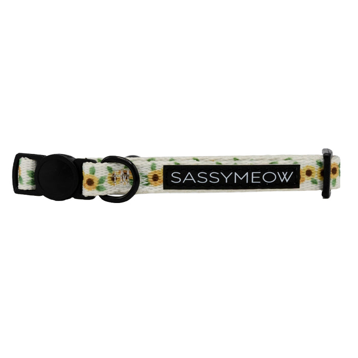 The Cat Collar - Sunflower Dreams by Sassy Woof features a white strap with yellow sunflowers, a black plastic buckle, adjustable fit, and is perfect for brightening up your cat's accessories collection.