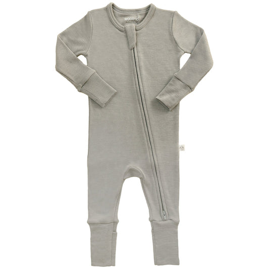 Dove color footless baby romper with a zipper on a white background