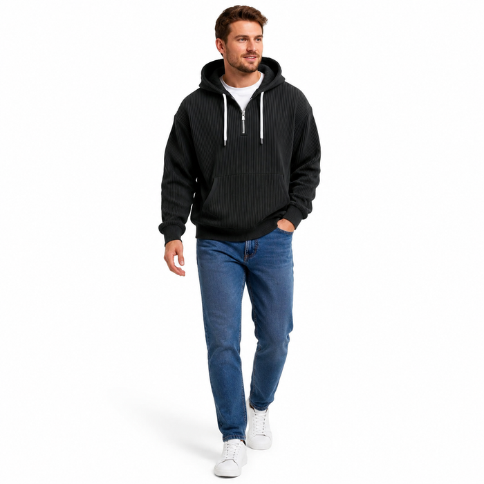 Men's black corduroy hoodie in a natural walking pose