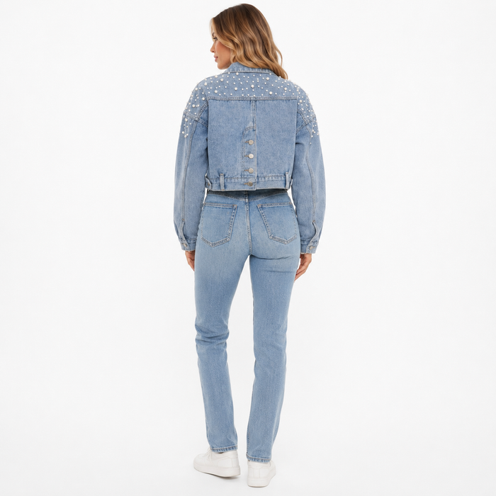 Statement denim jacket for ladies with pearl embellishments, cropped length, and tailored no-stretch appearance for layering.