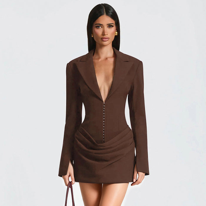 model wearing gray waist-cinching dress with statement earrings