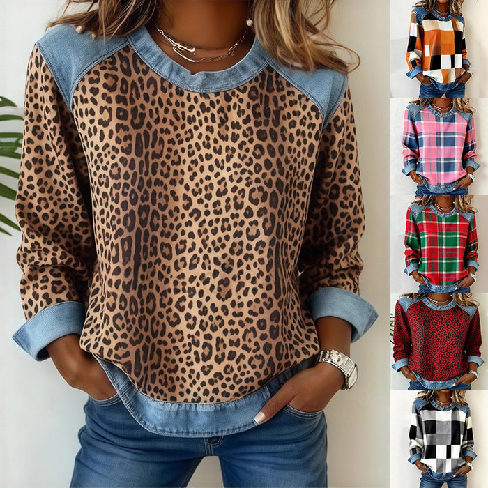 Woman wearing a leopard print top with blue accents, standing against a white background.