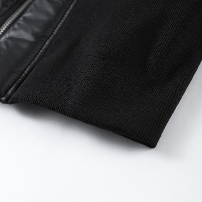 Close-up of a black jacket on a white background