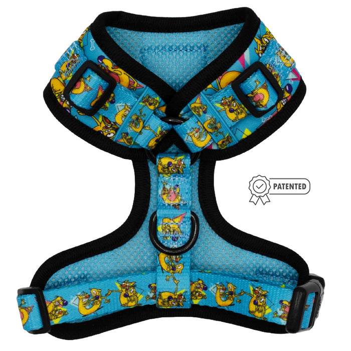 The Sassy Woof Dog Adjustable Harness - Nickelodeon CatDog™ is a blue, padded harness with black trim and playful CatDog graphics. It has adjustable straps, a metal D-ring, and a patented badge icon to the right of this no pull design.