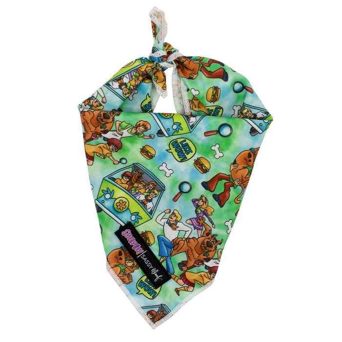 The Sassy Woof Dog Bandana - Scooby-Doo™ features fun Scooby-Doo, Mystery Machine, magnifying glass, paw print, burger, and bone designs. Pair it with a matching Scooby-Doo dog collar for an extra stylish look!.