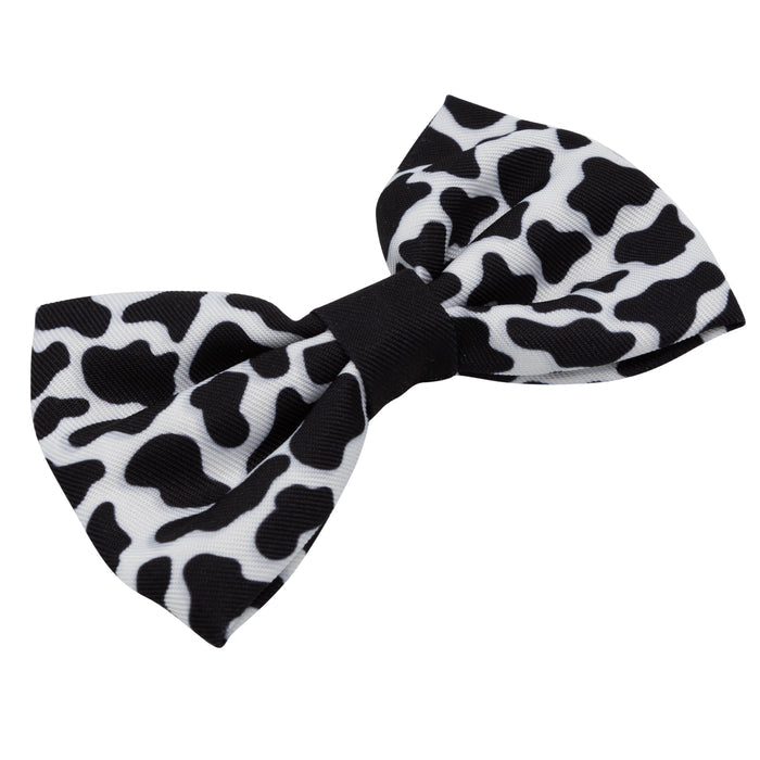 Introducing the “Dog Bowtie - Whole Milk” by Sassy Woof—a charming black-and-white accessory featuring a playful cow print pattern with irregular black spots on a crisp white background. This stylish collar bowtie is perfect for pets and makes a delightful addition to any pet accessory collection.
