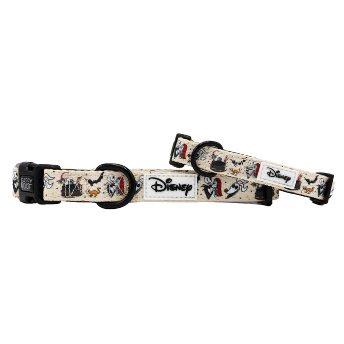 Two beige Sassy Woof dog collars featuring The Nightmare Before Christmas™ design. Each collar has a black buckle, a white Disney patch, and is perfect for the Puppy Growth Pawtection Plan.