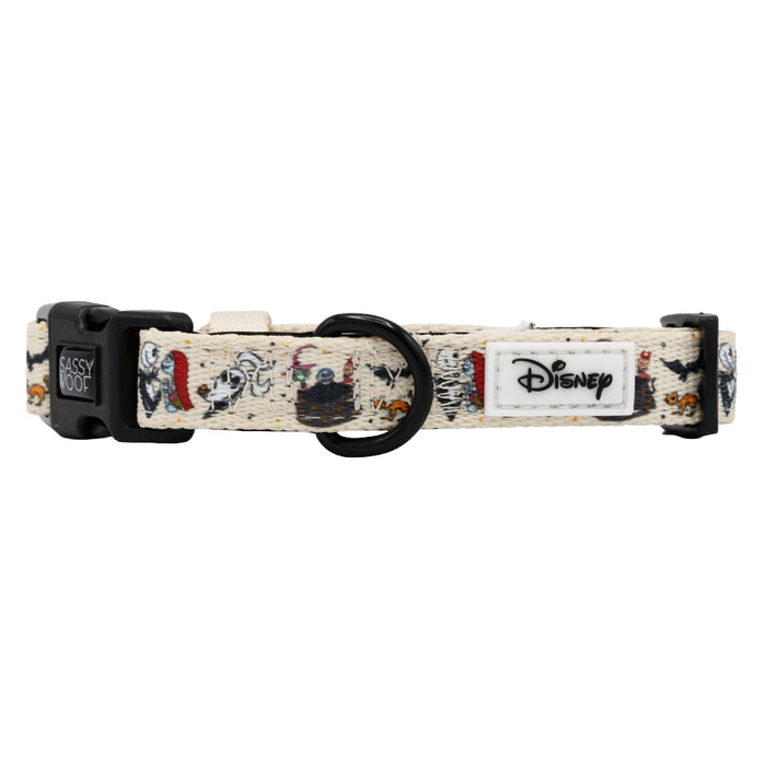 The Sassy Woof Dog Collar - The Nightmare Before Christmas™ (Beige) features colorful character illustrations, a black buckle, round black metal ring, and Disney logo tag—ideal for fans of this iconic Nightmare Before Christmas style.