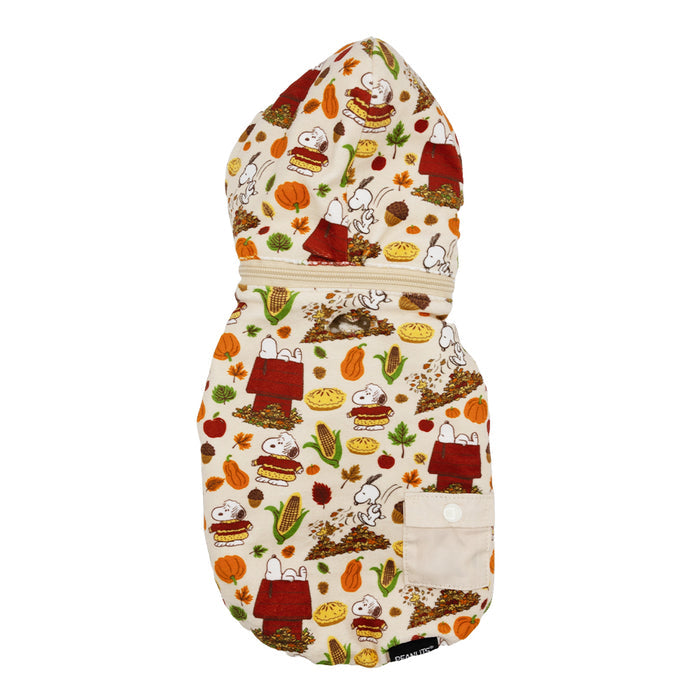 The Dog Reversible Sherpa Jacket - Peanuts™ Harvest by Sassy Woof features a cozy autumn print with Snoopy, pies, pumpkins, and fall leaves. This stylish jacket includes a beige pocket and button for extra charm.