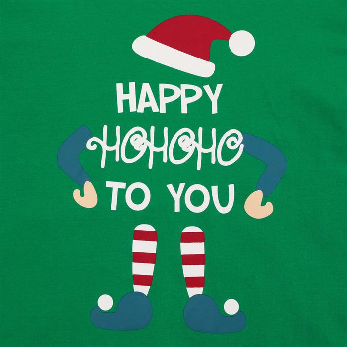 Matching green Christmas pajamas styled for a festive family bedtime scene