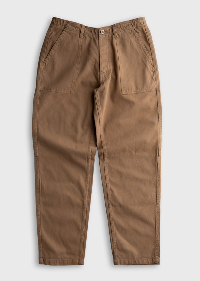 Tan work pants with front pockets and button closure, displayed on a white background, showcasing durable fabric and casual style.