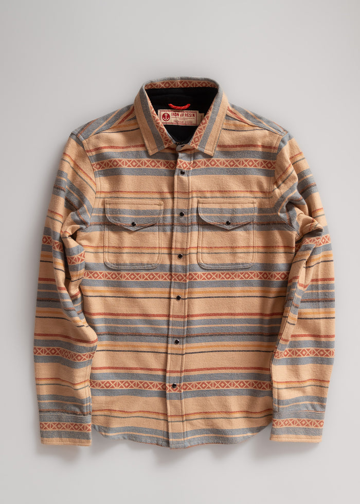 Tan and gray striped button-up shirt with a collar and two chest pockets, laid flat on a light background.
