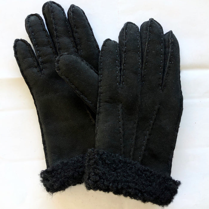 A pair of black Four Peaks hand stitched women’s lambskin gloves.