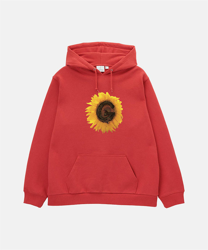 Gramicci crimson red G-Flower Hooded Sweatshirt with a sunflower graphic against a light-tone background.