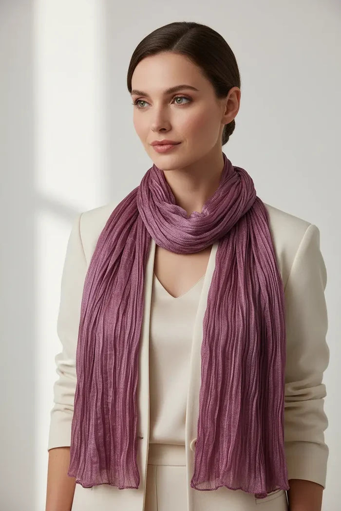 Grey skinny scarf wrapped once around the neck showing its narrow profile with an office outfit for clear product comparison.
