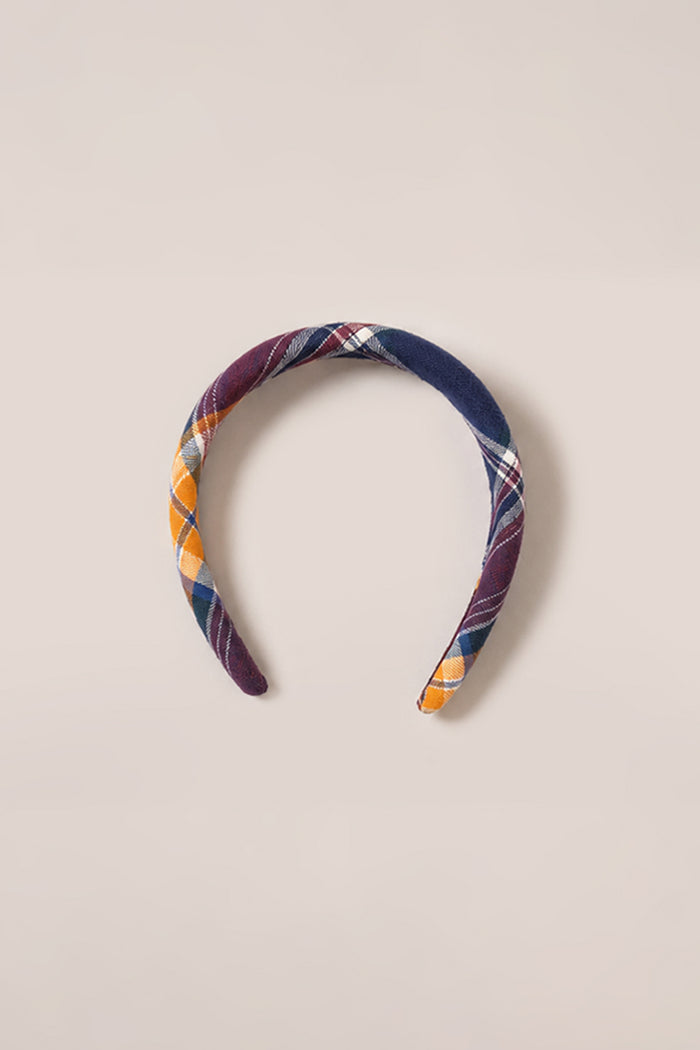 Brighten up your look with this colorful plaid fabric headband in yellow, navy, white, and burgundy, styled on a light beige background—pair it with our Ivy City Co Hair Bows in Midnight Plaid for a charming coordinated touch.