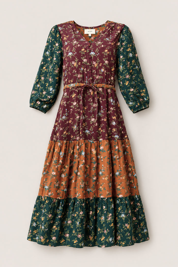 Introducing the Harlowe Dress in Elysian Vine by Ivy City Co: a long-sleeve, tiered maxi dress with elegant puff sleeves and a floral print in beautiful shades of burgundy, green, and rust-orange. Designed with a cinched tie waist and flowy silhouette, this stylish dress is also maternity friendly.