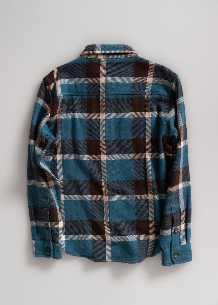 Blue and brown plaid flannel shirt with buttoned cuffs, displayed flat on a light gray background, showcasing its back design.