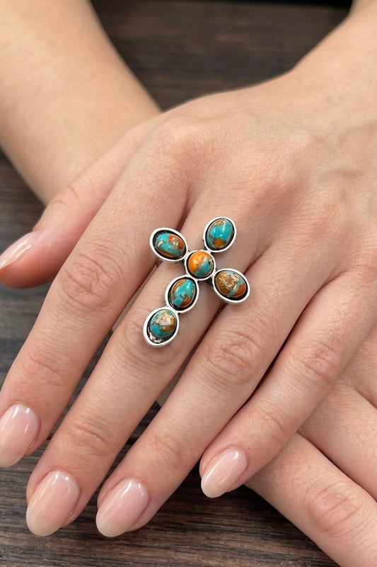 Natural gemstone cross statement ring with turquoise and earthy-toned stones, antique silver finish, and adjustable dual brass band.