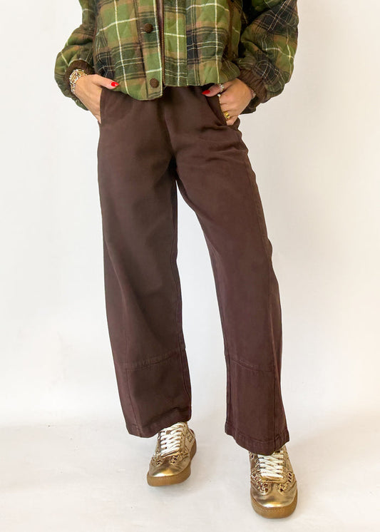 Woman wearing brown cropped wide leg pants