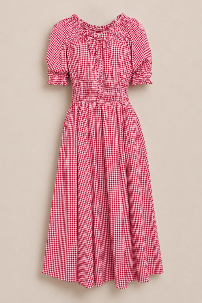 The Jessie Dress in Red Gingham by Ivy City Co features a smocked bodice, short puff sleeves, ruffled neckline, and elastic waist—maternity and nursing friendly—displayed against a neutral background.