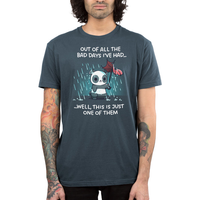Premium Cotton T-shirt_TeeTurtle denim blue Just Another Bad Day apparel featuring an anxious panda holding a blown-out umbrella in a rainstorm with the caption, “Out of all the bad days I’ve had… well, this is just one of them“.