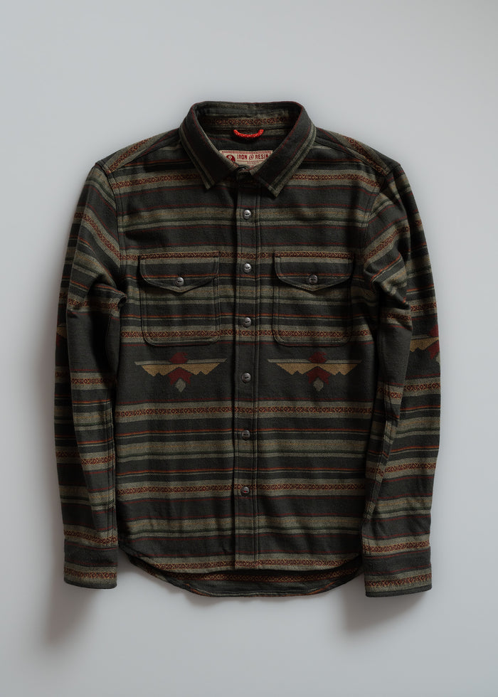 A green and brown patterned button-up shirt with two chest pockets, displayed against a plain background.