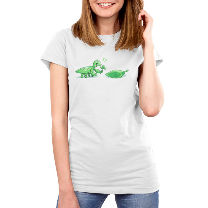 Premium Cotton T-shirt_TeeTurtle white Leaf Bug Love Story apparel featuring a leaf insect presenting a three-leaf clover to a leaf.