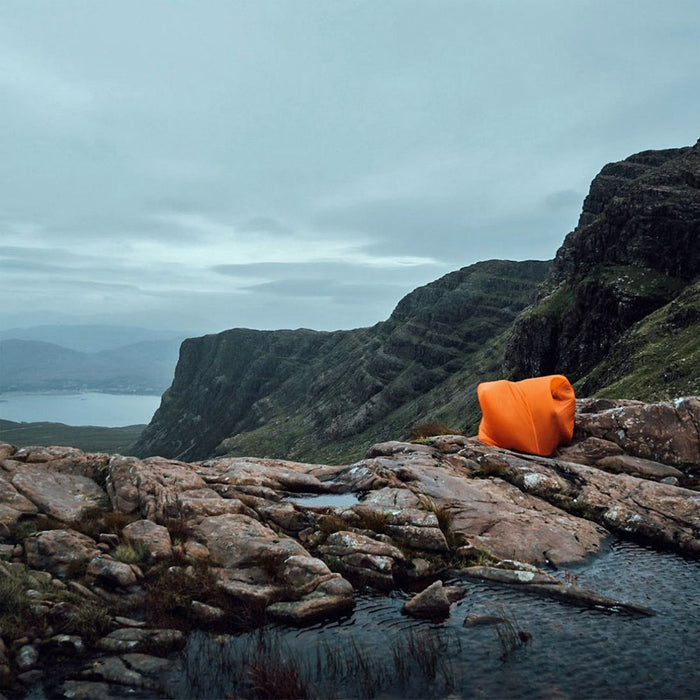 Lifestyle image of Lifesystems ultralight survival shelter being used by two people in the mountains