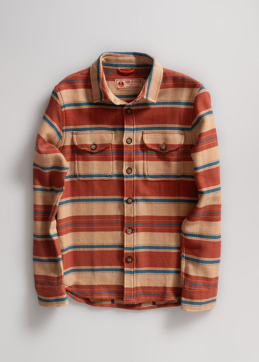 Striped flannel shirt in red, beige, and blue with button front and two chest pockets, laid flat on a light background.