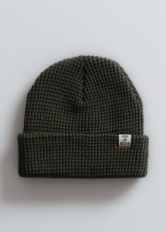 Dark green waffle-knit beanie with "Iron and Resin" label on the cuff, displayed on a plain white background.