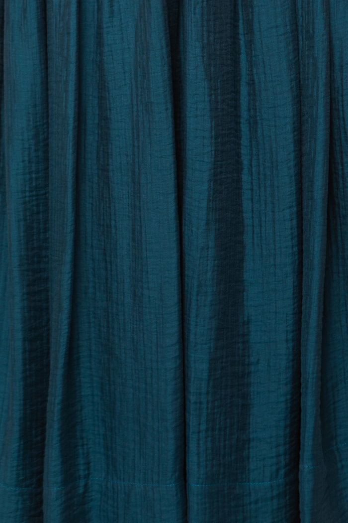 Close-up of textured teal fabric