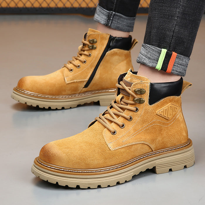 Men's leather desert boots worn with denim, showing Classic Brown color, round toe, lace-up closure, low heel, and ankle view