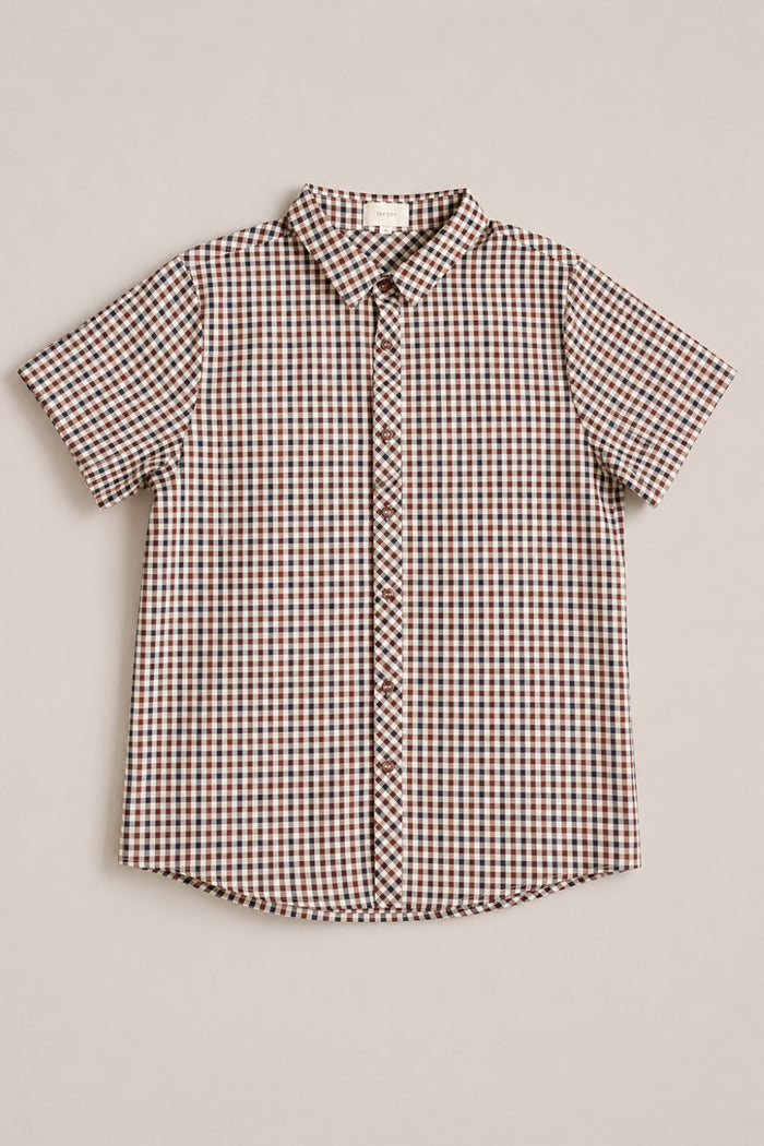 The Mens James Shirt in Chestnut Gingham by Ivy City Co is a short-sleeve button-up shirt showcasing a brown, black, and white gingham pattern. Crafted from soft cotton for comfort, it’s perfect for stylish fall layering. Shown laid flat on a light background.