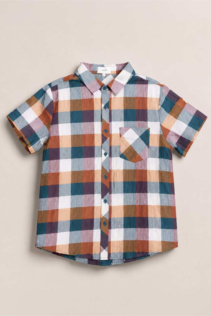 The Mens James Shirt in Maize Gingham by Ivy City Co features short sleeves, a button-up front, a classic collar neckline, and a multicolored plaid pattern in shades of blue, brown, orange, and white. It includes a left chest pocket and is crafted from a comfortable cotton-blend fabric for all-day wear.