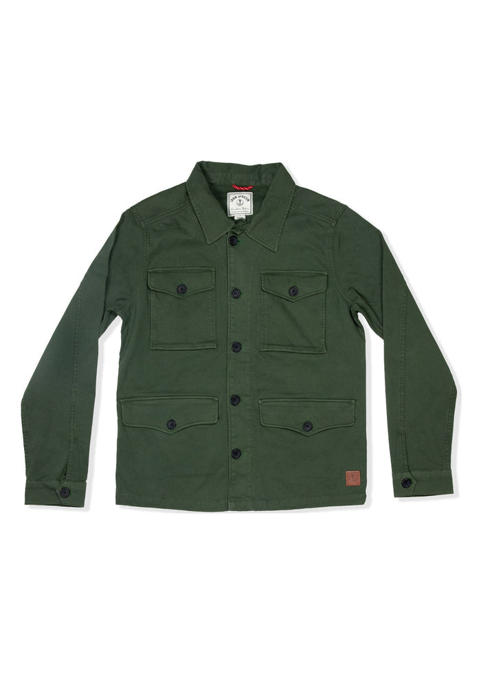 Green utility jacket with button closure and four pockets, featuring a collar and a small brown patch on the lower right side.