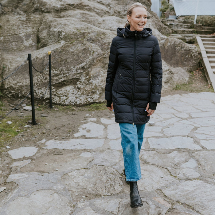 Woman wearing Moke - Sydney Cloud Touch 90/10 Down Coat (SYDNEY) in the colour Black.