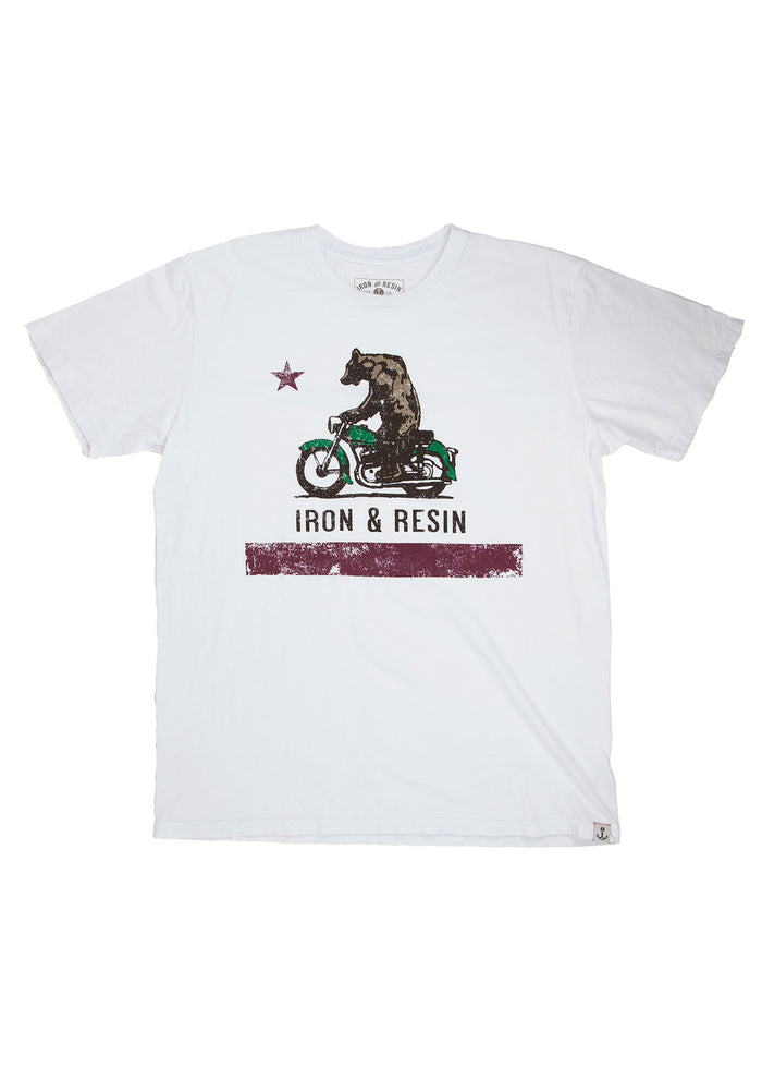 White T-shirt with a bear riding a green motorcycle, a star above, and "Iron & Resin" text below. Simple, bold graphic design.