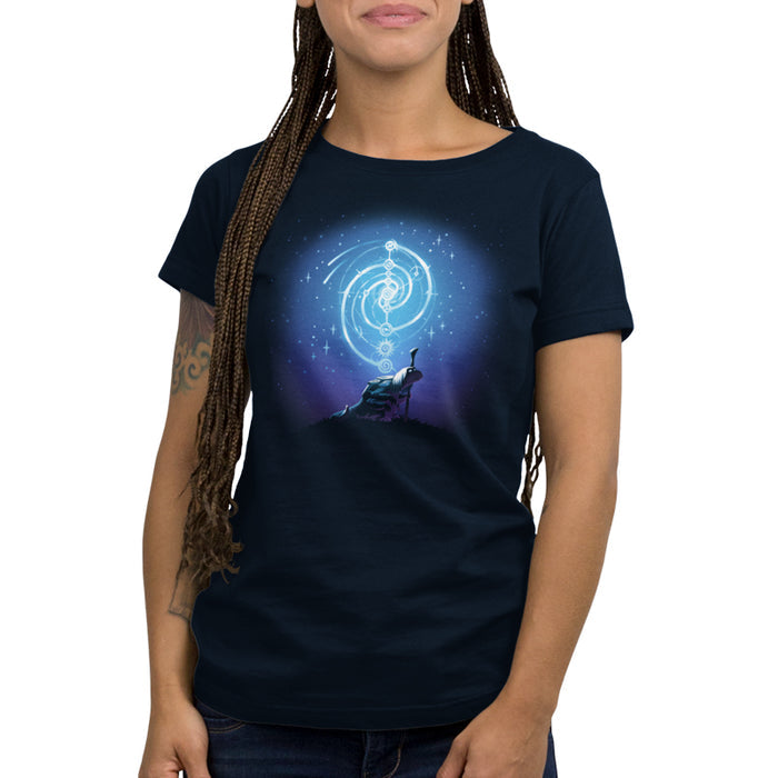 Premium Cotton T-shirt_TeeTurtle navy blue Mystical urRu apparel featuring an urRu holding a staff on a hilltop looking into the distance with mystical celestial circular patterns above it against a starry background.