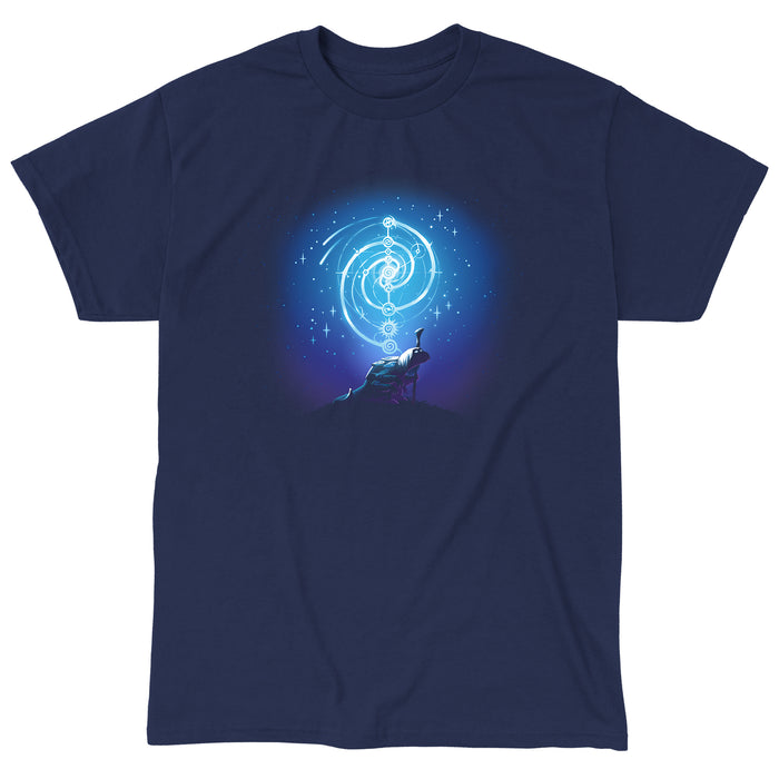 Classic Cotton T-shirt_TeeTurtle navy blue Mystical urRu apparel featuring an urRu holding a staff on a hilltop looking into the distance with mystical celestial circular patterns above it against a starry background.