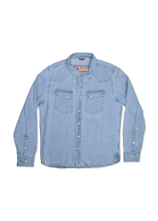 Light blue denim shirt with long sleeves, buttoned front, and two chest pockets, laid flat on a white background.